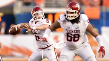 Dec 31, 2015; Miami Gardens, FL, USA; Oklahoma Sooners quarterback Baker Mayfield (6) drops back to pass as guard Jonathan Alvarez (68) blocks against the Clemson Tigersin the first quarter of the 2015 CFP Semifinal at the Orange Bowl at Sun Life Stadium. Mandatory Credit: John David Mercer-USA TODAY Sports