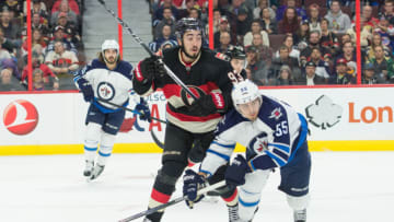 Nov5, 2015; Ottawa, Ontario, CAN; Ottawa Senators center Mika Zibanejad (93) and Winnipeg Jets center Mark Schiefele (55) battle for position in the first period at Canadian Tire Centre. Mandatory Credit: Marc DesRosiers-USA TODAY Sports