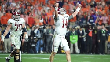 Jan 11, 2016; Glendale, AZ, USA; Alabama Crimson Tide quarterback Jake Coker (14) celebrates after beating the Clemson Tigers in the 2016 CFP National Championship at University of Phoenix Stadium. Mandatory Credit: Kirby Lee-USA TODAY Sports