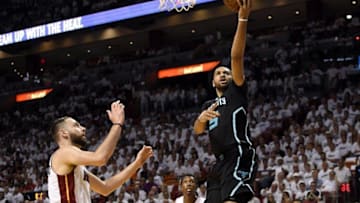 May 1, 2016; Miami, FL, USA; Charlotte Hornets guard Nicolas Batum (5) drives to the basket as Miami Heat forward Josh McRoberts (4) looks on during the first half in game seven of the first round of the NBA Playoffs at American Airlines Arena. Mandatory Credit: Steve Mitchell-USA TODAY Sports