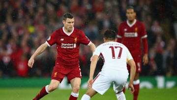 LIVERPOOL, ENGLAND - APRIL 24: James Milner of Liverpool is faced by Cengiz Under of AS Roma during the UEFA Champions League Semi Final First Leg match between Liverpool and A.S. Roma at Anfield on April 24, 2018 in Liverpool, United Kingdom. (Photo by Clive Brunskill/Getty Images)