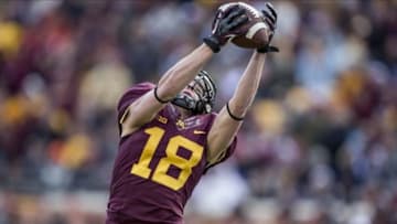 Oct 26, 2013; Minneapolis, MN, USA; Minnesota Golden Gophers wide receiver Derrick Engel (18) catches a touchdown in the second quarter against the Nebraska Cornhuskers at TCF Bank Stadium. Mandatory Credit: Jesse Johnson-USA TODAY Sports