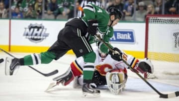 Jan 25, 2016; Dallas, TX, USA; Dallas Stars left wing Jamie Benn (14) scores a goal against Calgary Flames goalie Karri Ramo (31) during the second period at the American Airlines Center. Mandatory Credit: Jerome Miron-USA TODAY Sports