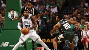 BOSTON, MA - OCTOBER 18: John Henson #31 of the Milwaukee Bucks defends Marcus Smart #36 of the Boston Celtics during the second quarter at TD Garden on October 18, 2017 in Boston, Massachusetts. NOTE TO USER: User expressly acknowledges and agrees that, by downloading and or using this Photograph, user is consenting to the terms and conditions of the Getty Images License Agreement. (Photo by Maddie Meyer/Getty Images)