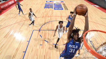 LAS VEGAS, NV - JULY 15: Norvel Pelle #31 of the Philadelphia 76ers dunks the ball against the Memphis Grizzlies during the 2018 Las Vegas Summer League on July 15, 2018 at the Thomas & Mack Center in Las Vegas, Nevada. NOTE TO USER: User expressly acknowledges and agrees that, by downloading and/or using this photograph, user is consenting to the terms and conditions of the Getty Images License Agreement. Mandatory Copyright Notice: Copyright 2018 NBAE (Photo by David Dow/NBAE via Getty Images)