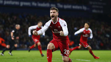 WEST BROMWICH, ENGLAND - DECEMBER 31: Shkodran Mustafi of Arsenal celebrates as James McClean of West Bromwich Albion scores an own goal for their first goal during the Premier League match between West Bromwich Albion and Arsenal at The Hawthorns on December 31, 2017 in West Bromwich, England. (Photo by Michael Steele/Getty Images)