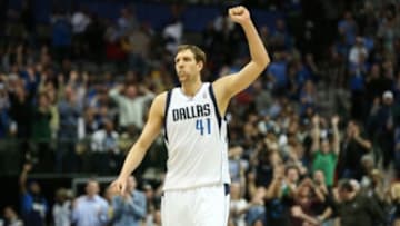Mar 9, 2014; Dallas, TX, USA; Dallas Mavericks forward Dirk Nowitzki (41) celebrates late in the fourth quarter after his team made a three point basket against the Indiana Pacers at American Airlines Center. The Mavs beat the Pacers 105-94. Mandatory Credit: Matthew Emmons-USA TODAY Sports