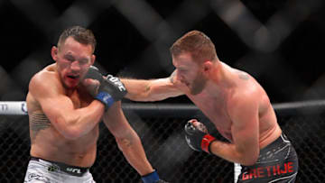 Nov 6, 2021; New York, NY, USA; Justin Gaethje (red gloves) competes against Michael Chandler (blue gloves) during UFC 268 at Madison Square Garden. Mandatory Credit: Ed Mulholland-USA TODAY Sports