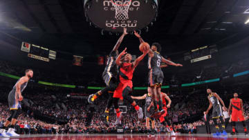 PORTLAND, OR - FEBRUARY 14: Damian Lillard #0 of the Portland Trail Blazers shoots the ball during the game against the Golden State Warriors on February 14, 2018 at the Moda Center in Portland, Oregon. NOTE TO USER: User expressly acknowledges and agrees that, by downloading and or using this Photograph, user is consenting to the terms and conditions of the Getty Images License Agreement. Mandatory Copyright Notice: Copyright 2018 NBAE (Photo by Sam Forencich/NBAE via Getty Images)