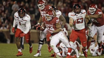NORMAN, OK - OCTOBER 28: Running back Rodney Anderson #24 of the Oklahoma Sooners cuts after breaking through the Texas Tech Red Raiders line at Gaylord Family Oklahoma Memorial Stadium on October 28, 2017 in Norman, Oklahoma. Oklahoma defeated Texas Tech 49-27. (Photo by Brett Deering/Getty Images)
