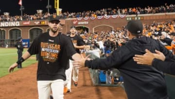 October 7, 2014; San Francisco, CA, USA; San Francisco Giants first baseman Brandon Belt (9, left) celebrates in the clubhouse after defeating the Washington Nationals 3-2 in game four of the 2014 NLDS baseball playoff game at AT&T Park. Mandatory Credit: Kyle Terada-USA TODAY Sports