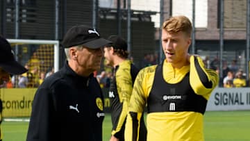 DORTMUND, GERMANY - AUGUST 20: Head coach Lucien Favre of Borussia Dortmund and Marco Reus of Borussia Dortmund look on during the Borussia Dortmund Training Session on August 20, 2019 in Dortmund, Germany. (Photo by TF-Images/Getty Images)