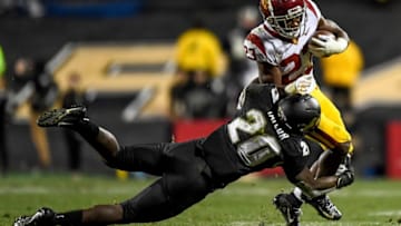 BOULDER, CO - OCTOBER 25: Kenan Christon #23 of the USC Trojans is tackled by Davion Taylor #20 of the Colorado Buffaloes in the fourth quarter of a game at Folsom Field on October 25, 2019 in Boulder, Colorado. (Photo by Dustin Bradford/Getty Images)
