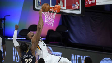 Derrick Favors of the New Orleans Pelicans tries to block Rudy Gobert (Photo by Ashley Landis-Pool/Getty Images)
