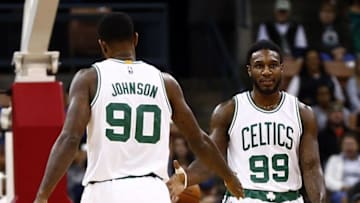 Oct 23, 2015; Manchester, NH, USA; Boston Celtics forward Jae Crowder (99) and forward Amir Johnson (90) celebrate against the Philadelphia 76ers during the first half at Verizon Wireless Arena. Mandatory Credit: Mark L. Baer-USA TODAY Sports