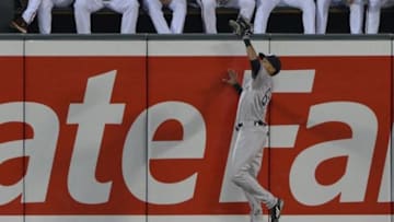 Jun 13, 2015; Baltimore, MD, USA; New York Yankees center fielder Mason Williams (63) catches a fly ball hit by Baltimore Orioles first baseman Steve Pearce (not pictured) in the fourth inning at Oriole Park at Camden Yards. Mandatory Credit: Tommy Gilligan-USA TODAY Sports
