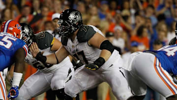 Oct 18, 2014; Gainesville, FL, USA; Missouri Tigers offensive lineman Evan Boehm (77) blocks against the Florida Gators during the first quarter at Ben Hill Griffin Stadium. Mandatory Credit: Kim Klement-USA TODAY Sports