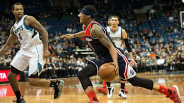 Mar 2, 2016; Minneapolis, MN, USA; Washington Wizards guard Bradley Beal (3) goes to the basket as Minnesota Timberwolves forward Greg Smith (4) goes to defend during the first quarter at Target Center. Mandatory Credit: Jeffrey Becker-USA TODAY Sports