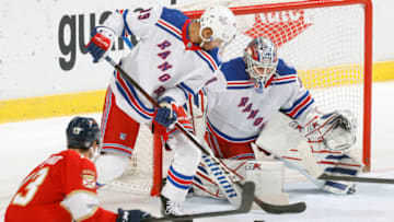 SUNRISE, FL - DECEMBER 29: K'Andre Miller #79 assists Goaltender Igor Shesterkin #31 of the New York Rangers defends the shot by Sam Reinhart #13 of the Florida Panthers during first period action at the FLA Live Arena on December 29, 2021 in Sunrise, Florida. (Photo by Joel Auerbach/Getty Images)