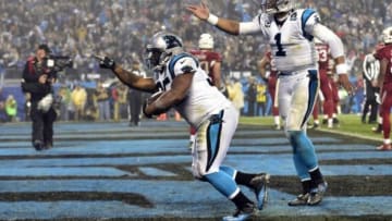 Jan 3, 2015; Charlotte, NC, USA; Carolina Panthers fullback Mike Tolbert (35) celebrates with quarterback Cam Newton (1) after a touchdown during the third quarter against the Arizona Cardinals in the 2014 NFC Wild Card playoff football game at Bank of America Stadium. Mandatory Credit: Bob Donnan-USA TODAY Sports