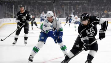 LOS ANGELES, CALIFORNIA - OCTOBER 30: Josh Leivo #17 of the Vancouver Canucks chases Drew Doughty #8 of the Los Angeles Kings for the puck during the first period at Staples Center on October 30, 2019 in Los Angeles, California. (Photo by Harry How/Getty Images)