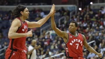 Jan 8, 2016; Washington, DC, USA; Toronto Raptors forward Luis Scola (4) and guard Kyle Lowry (7) celebrate on the court during the second half against the Washington Wizards at Verizon Center. The Toronto Raptors defeated Washington Wizards 97-88. Mandatory Credit: Tommy Gilligan-USA TODAY Sports