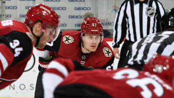 GLENDALE, ARIZONA - OCTOBER 17: Lawson Crouse #67 of the Arizona Coyotes gets ready during a face-off against the Nashville Predators at Gila River Arena on October 17, 2019 in Glendale, Arizona. (Photo by Norm Hall/NHLI via Getty Images)