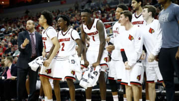 LOUISVILLE, KY - DECEMBER 11: Darius Perry #2 and Lance Thomas #1 of the Louisville Cardinals celebrate after a basket against the Bryant Bulldogs during the game at KFC YUM! Center on December 11, 2017 in Louisville, Kentucky. (Photo by Andy Lyons/Getty Images)