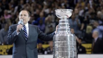 Jun 13, 2014; Los Angeles, CA, USA; NHL commissioner Gary Bettman presents the Stanley Cup to the Los Angeles Kings after game five of the 2014 Stanley Cup Final against the Los Angeles Kings at Staples Center. Mandatory Credit: Gary A. Vasquez-USA TODAY Sports