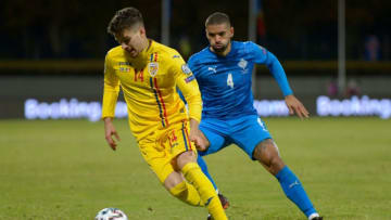 Romania's forward Ianis Hagi (L) vies for the ball with Iceland's midfielder Victor Palsson during the Euro 2020 play-off semi-final football match between Iceland and Romania at the National Stadium in Reykjavik, Iceland, on October 8, 2020. (Photo by Haraldur GUDJONSSON / AFP) (Photo by HARALDUR GUDJONSSON/AFP via Getty Images)