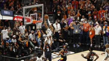 PHOENIX, ARIZONA - JULY 17: Giannis Antetokounmpo #34 of the Milwaukee Bucks dunks against Chris Paul #3 of the Phoenix Suns during the second half in Game Five of the NBA Finals at Footprint Center on July 17, 2021 in Phoenix, Arizona. NOTE TO USER: User expressly acknowledges and agrees that, by downloading and or using this photograph, User is consenting to the terms and conditions of the Getty Images License Agreement. (Photo by Christian Petersen/Getty Images)