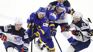COPENHAGEN, DENMARK - MAY 07: Alexandre Texier and Florian Douayof France in action with Johan Larsson and Jacob De La Rose of Sweden during the 2018 IIHF Ice Hockey World Championship Group A between Sweden and France at Royal Arena on May 7, 2018 in Copenhagen, Denmark. (Photo by Xavier Laine/Getty Images)