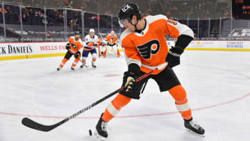 Mar 22, 2021; Philadelphia, Pennsylvania, USA; Philadelphia Flyers defenseman Philippe Myers (5) gathers the puck against the New York Islanders at Wells Fargo Center. Mandatory Credit: Eric Hartline-USA TODAY Sports