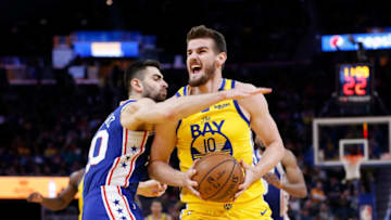 SAN FRANCISCO, CALIFORNIA - MARCH 07: Dragan Bender #10 of the Golden State Warriors drives to the basket against Furkan Korkmaz #30 of the Philadelphia 76ers in the second half at Chase Center on March 07, 2020 in San Francisco, California. NOTE TO USER: User expressly acknowledges and agrees that, by downloading and/or using this photograph, user is consenting to the terms and conditions of the Getty Images License Agreement. (Photo by Lachlan Cunningham/Getty Images)