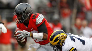 COLUMBUS, OH - NOVEMBER 26: Maurice Hurst #73 of the Michigan Wolverines sacks J.T. Barrett #16 of the Ohio State Buckeyes during the fourth quarter of their game at Ohio Stadium on November 26, 2016 in Columbus, Ohio. (Photo by Gregory Shamus/Getty Images)