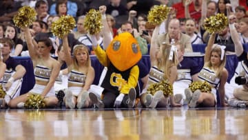 ATLANTA - MARCH 13: Mascot and cheerleaders of the Georgia Tech Yellow Jackets watches the action against the Florida State Seminoles during day two of the 2009 ACC Men's Basketball Tournament on March 13, 2009 at the Georgia Dome in Atlanta, Georgia. (Photo by Kevin C. Cox/Getty Images)