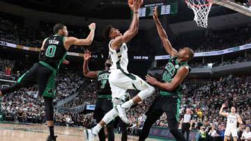 MILWAUKEE, WI - APRIL 28: Giannis Antetokounmpo #34 of the Milwaukee Bucks drives to the basket against the Boston Celtics during Game One of the Eastern Conference Semi-Finals of the 2019 NBA Playoffs on April 28, 2019 at the Fiserv Forum Center in Milwaukee, Wisconsin. NOTE TO USER: User expressly acknowledges and agrees that, by downloading and or using this Photograph, user is consenting to the terms and conditions of the Getty Images License Agreement. Mandatory Copyright Notice: Copyright 2019 NBAE (Photo by Nathaniel S. Butler/NBAE via Getty Images).