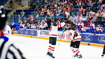 BASEL, SWITZERLAND - APRIL 30: Andrew Cristall of Canada (L) celebrating Matthew Wood of Canada (R) for his goalduring U18 Ice Hockey World Championship bronze medal match between Canada and Slovakia at St. Jakob-Park at St. Jakob-Park on April 30, 2023 in Basel, Switzerland. (Photo by Jari Pestelacci/Eurasia Sport Images/Getty Images)