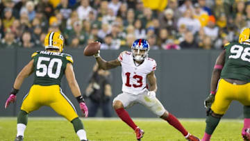 Oct 9, 2016; Green Bay, WI, USA; New York Giants wide receiver Odell Beckham Jr. (13) rushes with the football as Green Bay Packers linebacker Blake Martinez (50) defends during the third quarter at Lambeau Field. Green Bay won 23-16. Mandatory Credit: Jeff Hanisch-USA TODAY Sports