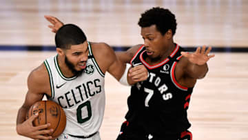 LAKE BUENA VISTA, FLORIDA - SEPTEMBER 05: Jayson Tatum #0 of the Boston Celtics drives the ball during the fourth quarter against Kyle Lowry #7 of the Toronto Raptors in Game Four of the Eastern Conference Second Round during the 2020 NBA Playoffs at the Field House at the ESPN Wide World Of Sports Complex on September 05, 2020 in Lake Buena Vista, Florida. NOTE TO USER: User expressly acknowledges and agrees that, by downloading and or using this photograph, User is consenting to the terms and conditions of the Getty Images License Agreement. (Photo by Douglas P. DeFelice/Getty Images)