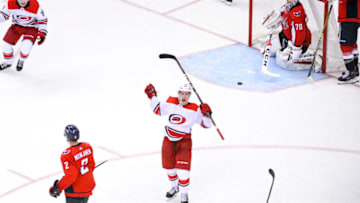 WASHINGTON, DC - APRIL 24: Carolina Hurricanes left wing Brock McGinn (23) celebrates after his game winning goal in the second overtime against Washington Capitals goaltender Braden Holtby (70) on April 24, 2019, at the Capital One Arena in Washington, D.C. in the first round of the Stanley Cup Playoffs. (Photo by Mark Goldman/Icon Sportswire via Getty Images)