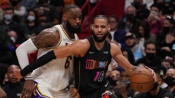 Miami Heat forward Caleb Martin (16) drives the ball around Los Angeles Lakers forward Lebron James (6)(Jasen Vinlove-USA TODAY Sports)