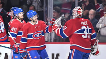 MONTREAL, QC - NOVEMBER 01: Goaltender Carey Price #31 congratulates Jesperi Kotkaniemi #15 of the Montreal Canadiens for his first career NHL goal against the Washington Capitals during the NHL game at the Bell Centre on November 1, 2018 in Montreal, Quebec, Canada. (Photo by Minas Panagiotakis/Getty Images)