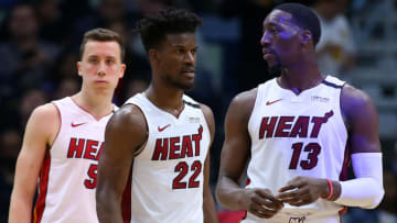 Jimmy Butler #22 of the Miami Heat, Bam Adebayo #13 and Duncan Robinson #55 react against the New Orleans Pelicans (Photo by Jonathan Bachman/Getty Images)