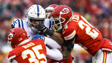 KANSAS CITY, MO - JANUARY 12: Eric Ebron #85 of the Indianapolis Colts is tackled by Charvarius Ward #35 and Jordan Lucas #24 of the Kansas City Chiefs during the first quarter of the AFC Divisional Round playoff game at Arrowhead Stadium on January 12, 2019 in Kansas City, Missouri. (Photo by Jamie Squire/Getty Images)