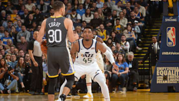 OAKLAND, CA - FEBRUARY 12: Stephen Curry #30 of the Golden State Warriors handles the ball against Donovan Mitchell #45 of the Utah Jazz on February 12, 2019 at ORACLE Arena in Oakland, California. Copyright 2019 NBAE (Photo by Noah Graham/NBAE via Getty Images)