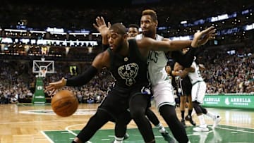Apr 8, 2016; Boston, MA, USA; Milwaukee Bucks center Greg Monroe (15) dribbles the ball as Boston Celtics center Jared Sullinger (back) defends during the first half at TD Garden. Mandatory Credit: Mark L. Baer-USA TODAY Sports