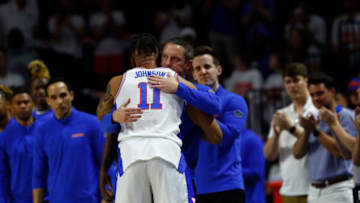 Mar 5, 2022; Gainesville, Florida, USA; Florida Gators forward Keyontae Johnson (11) hugs head coach Mike White as he is recognized before the game against the Kentucky Wildcats during the first half at Billy Donovan Court at Exactech Arena. Mandatory Credit: Kim Klement-USA TODAY Sports