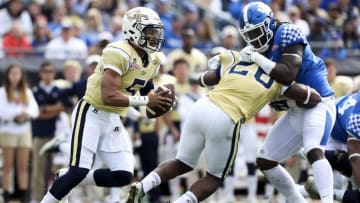 Dec 31, 2016; Jacksonville, FL, USA; Georgia Tech Yellow Jackets quarterback Justin Thomas (5) looks to run the ball in the second quarter against the Kentucky Wildcats at EverBank Field. Mandatory Credit: Logan Bowles-USA TODAY Sports