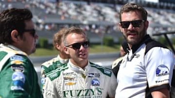 Ed Carpenter (center) talks with crew members on pit lane. Photo Credit: Chris Owens/Courtesy of IndyCar
